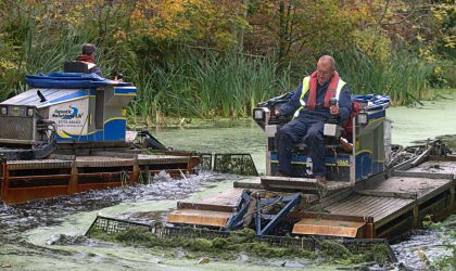 weed boats at work on The Bury to Bolton Canal