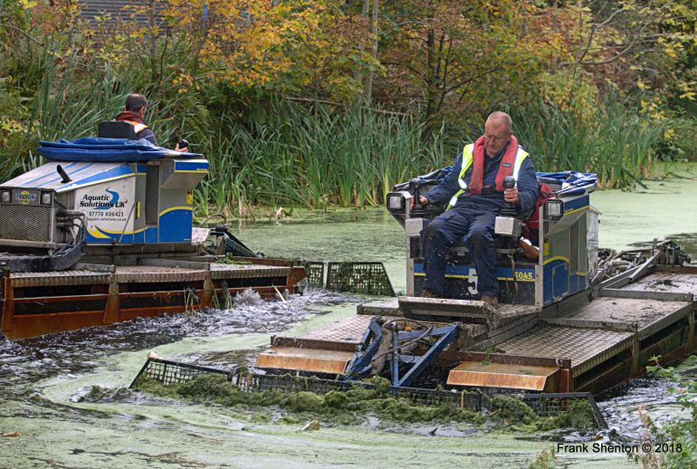 weed boats at work on The Bury to Bolton Canal